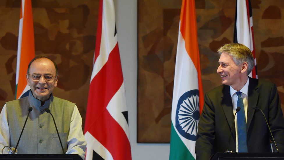 British chancellor Philip Hammond (R) and Indian Finance Minister Arun Jaitley take part in a joint press conference in New Delhi on April 4, 2017.