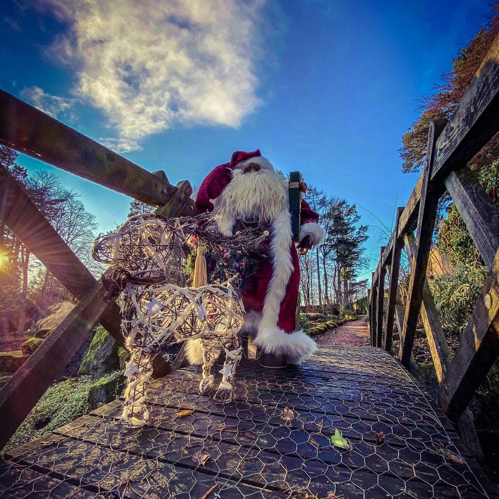 Santa crossing a bridge