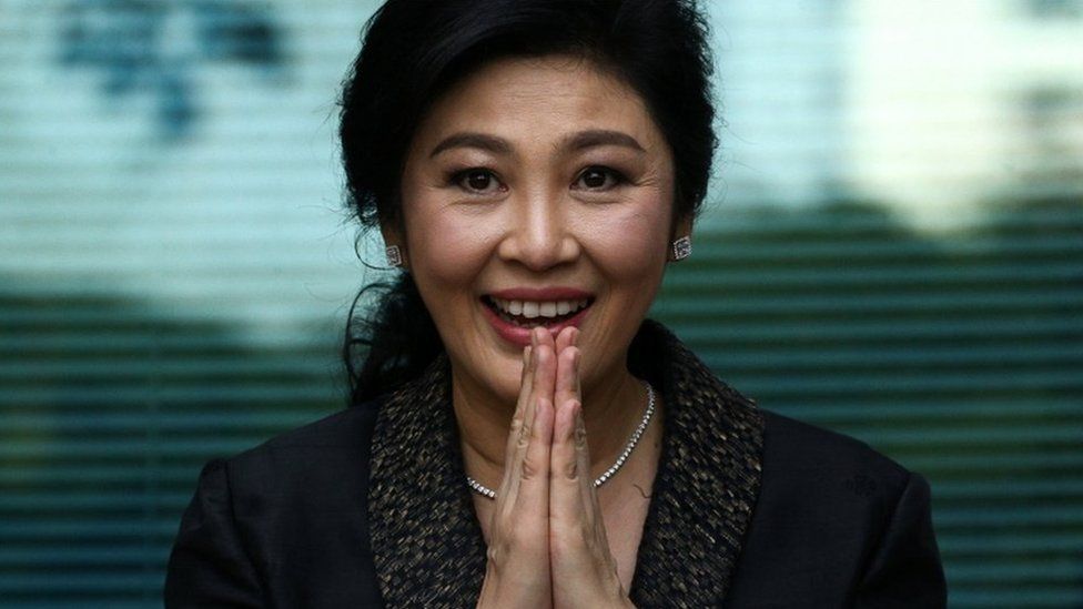 Ousted former Thai prime minister Yingluck Shinawatra greets supporters as she arrives at the Supreme Court in Bangkok, Thailand, August 1, 2017.