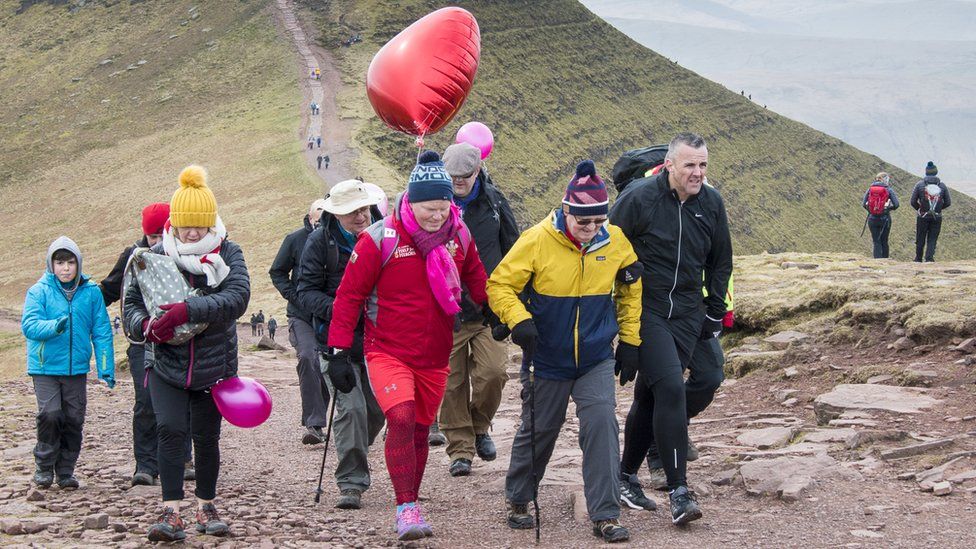 Des Lally and his dad approach the summit