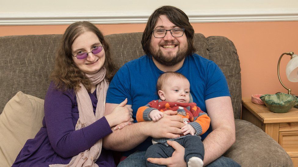 Edward Grace, pictured with his wife and their one-year old son