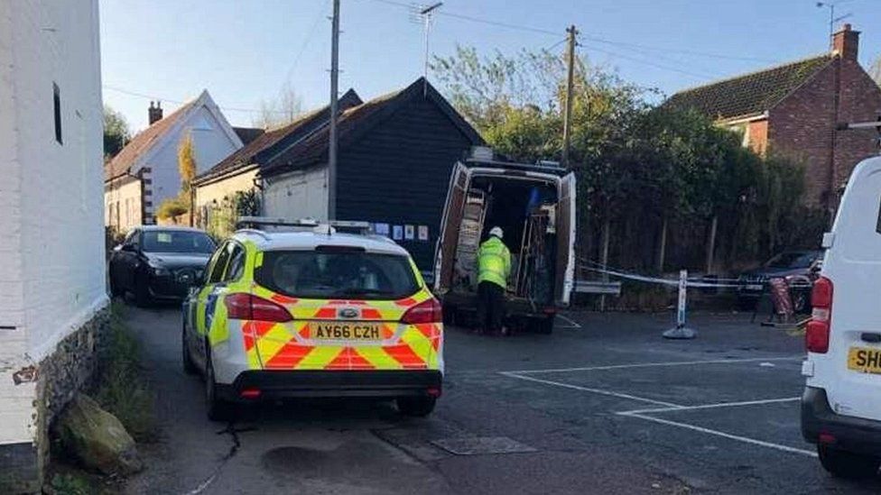 Police at the scene of the ram-raid in Debenham, Suffolk