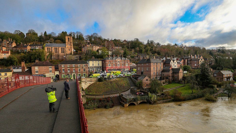 Flooding in Ironbridge, Shropshire, on 27 February, as residents in riverside properties in the area have been told to leave their homes and businesses immediately after temporary flood barriers were overwhelmed by water