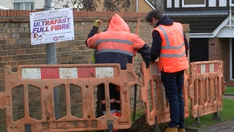 MS3 Networks workers prepare the ground for a pole installation