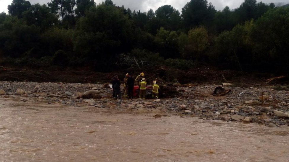 Catalan police were trying to find two missing people after an empty car was found in the river