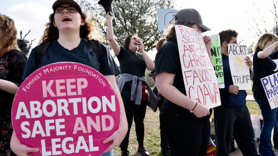 Abortion rights supporters chant pro-choice slogans during a rally outside of the Planned Parenthood South Dallas Surgical Health Services Center, Saturday morning, Feb. 11, 2017