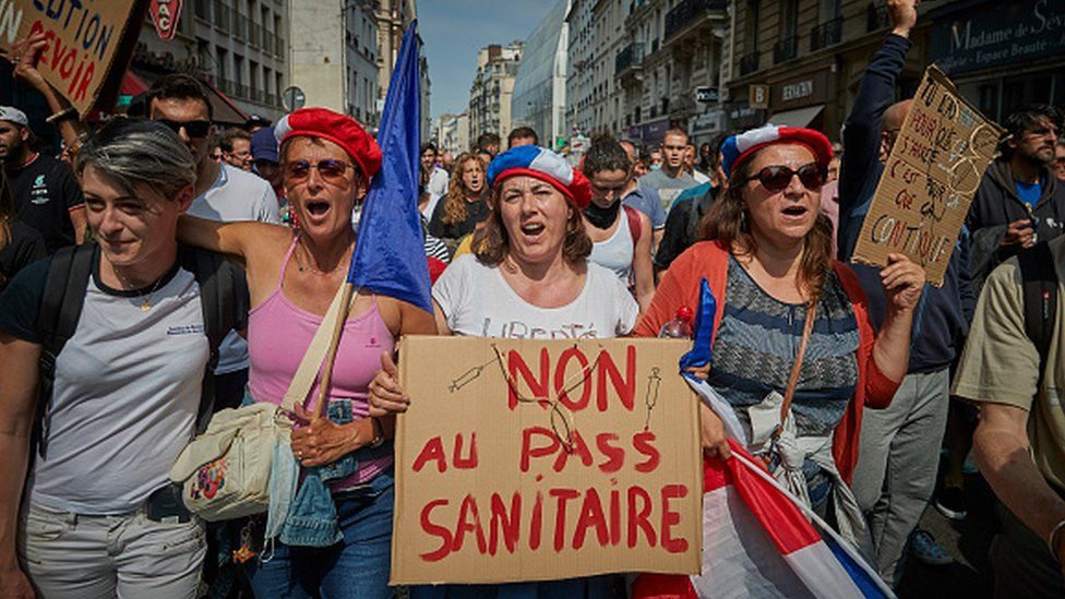 Demonstrators march through the streets of Paris