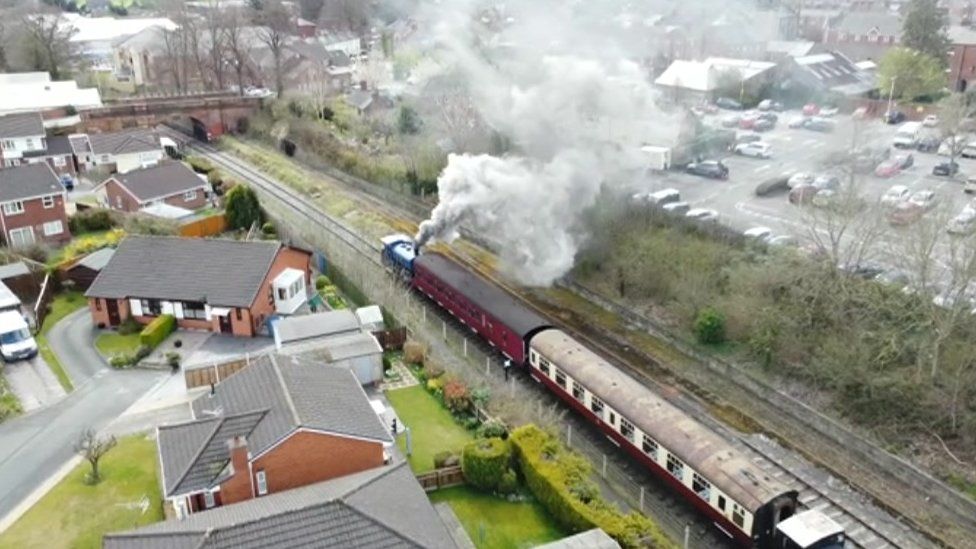 Steam train leaves Oswestry