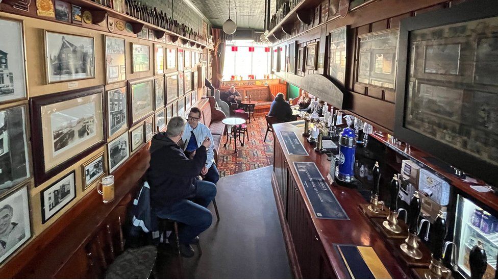 Drinkers enjoy a lunchtime pint at The Whalebone