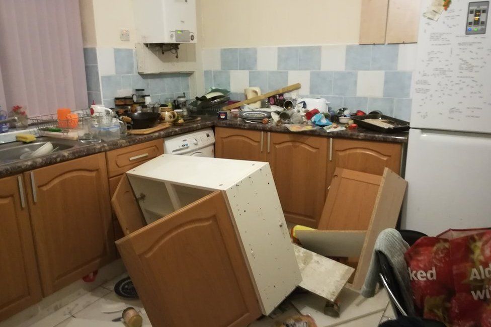 Kitchen unit having fallen off a wall in a HMO