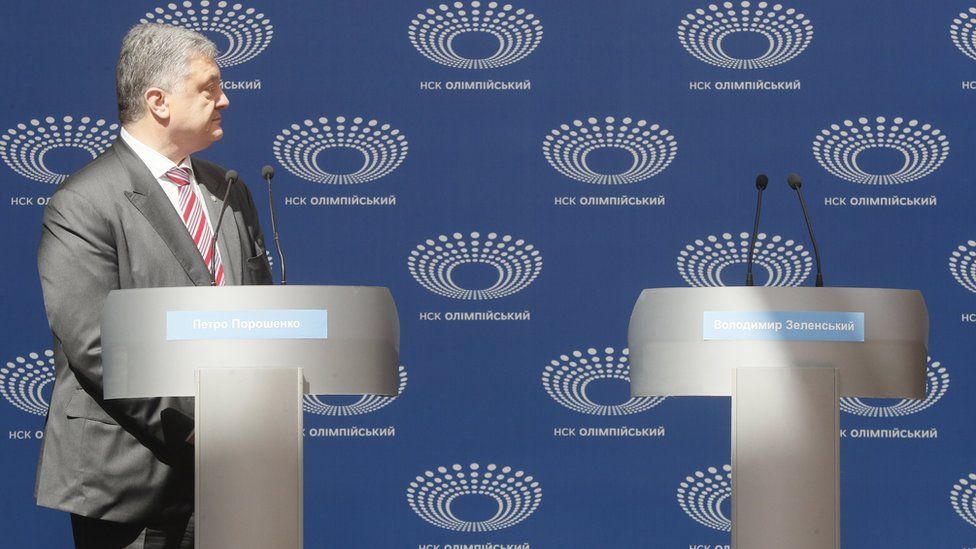 Acting Ukrainian President and Presidential candidate Petro Poroshenko looks at the empty Volodymyr Zelensky"s podium during debate at the Olimpiyskiy Stadium in Kiev, Ukraine, 14 April 2019.