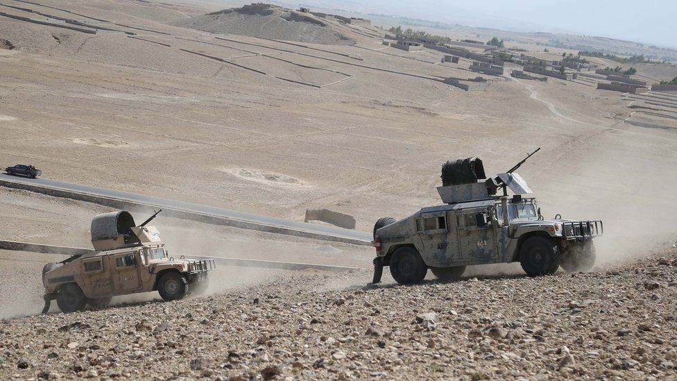 Afghan security officials patrol during an operation against suspected militants, in Chaparhar district of Nangarhar province, Afghanistan, 09 July 2019