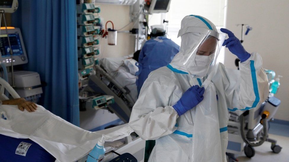 Medical staff treat a patient inside the extracorporeal membrane oxygenation coronavirus ward at the Interior and Administration Ministry (MSWiA) hospital in Warsaw, Poland, March 8, 2021
