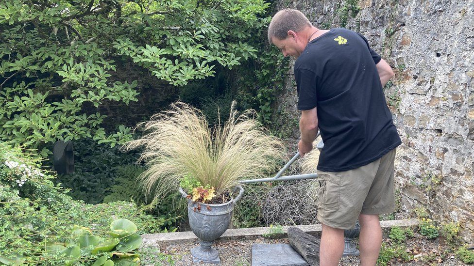 Steve watering plants