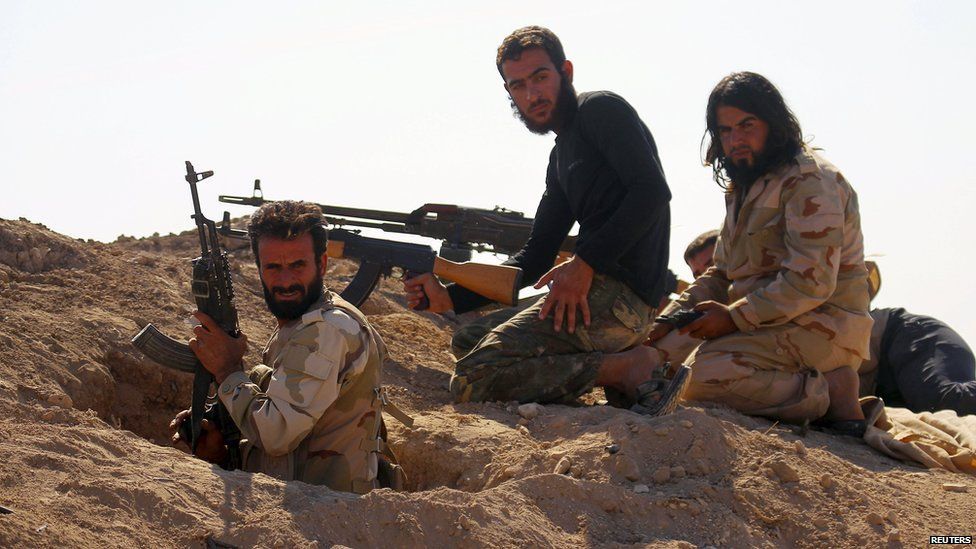 Rebel fighters dig in in Syria's Hama province, 11 October