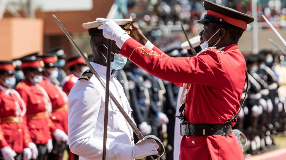 A national guard gets his hat straightened in Banjul, The Gambia - Wednesday 19 January 2022