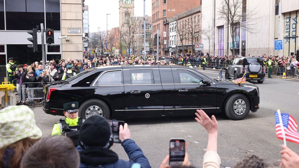 Joe Biden travels through Belfast city centre in his presidential car