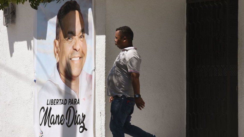 A relative leaves the house of Luis Manuel Diaz, father of Liverpool's Colombian winger Luis Diaz