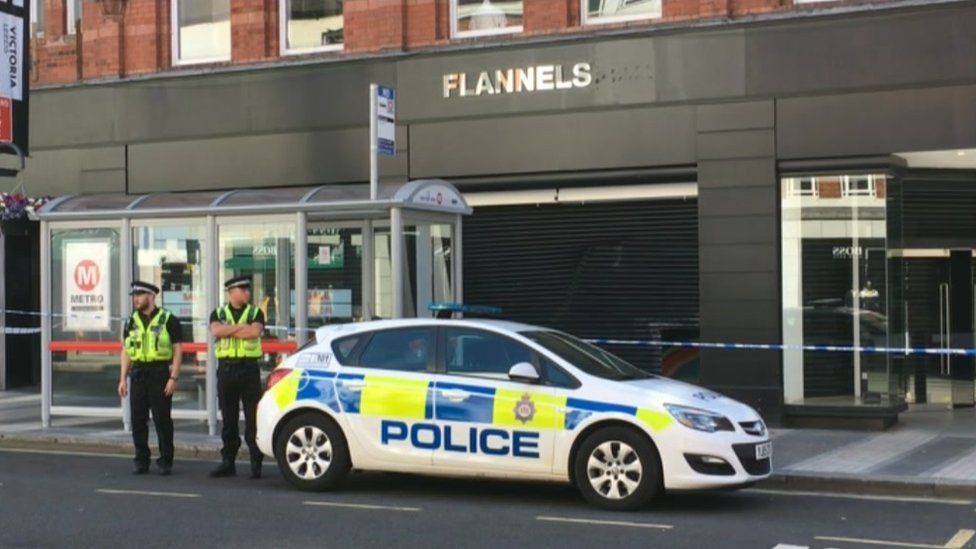 Police car outside Flannels