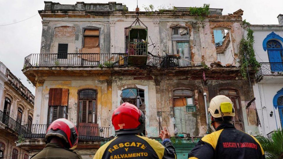 Emergency services work on the site where a residential building collapsed in Havana, Cuba, October 4, 2023. REUTERS