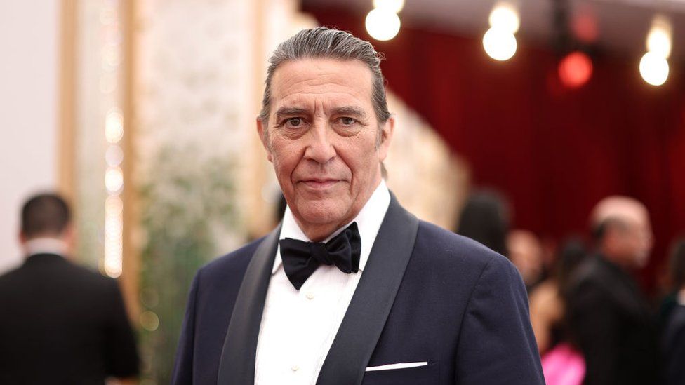 Ciarán Hinds on the red carpet at the 2022 Oscars in Hollywood