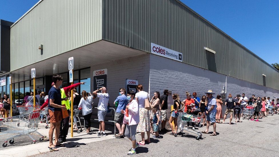People queue outside a supermarket in Perth, Australia, 31 January 2021.
