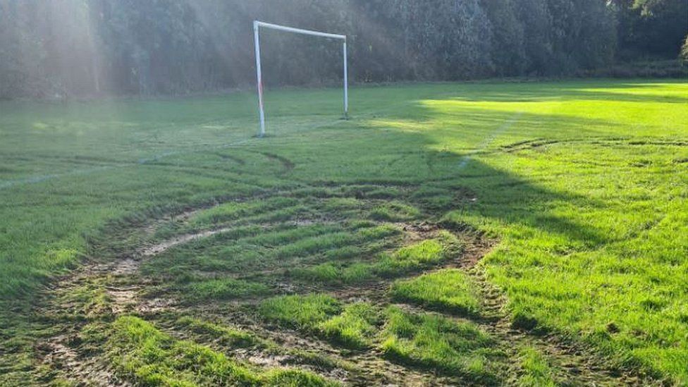 Tyre tracks on football pitch