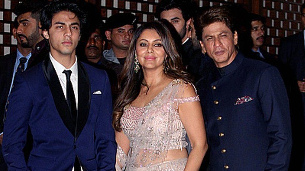 Aryan Khan (left) with his parents Gauri and Shah Rukh Khan