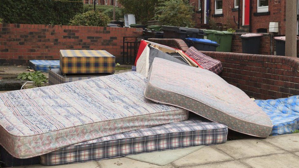 Mattresses in a communal garden area