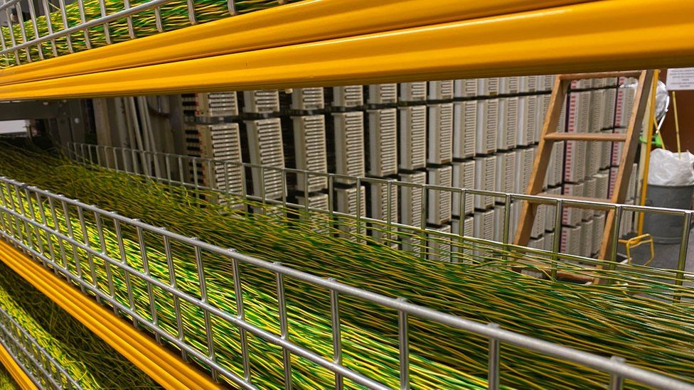 Strings of copper cable are laid out on racks