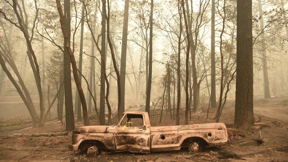 A burnt out truck is seen in Paradise, California after the Camp fire tore through the area on November 10, 2018