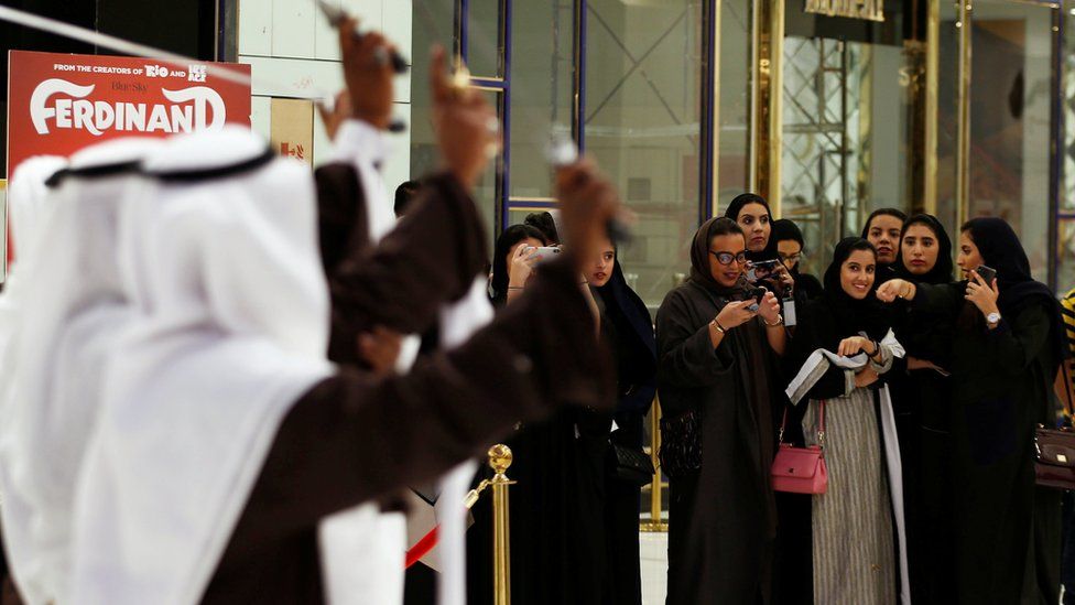 Saudi women attend the opening of a cinema in Saudi Arabia
