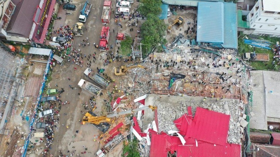 An overhead view of the collapsed under-construction building