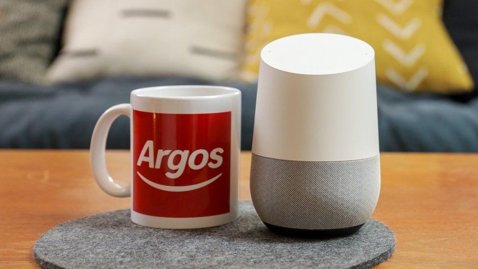Argos mug next to a smart speaker