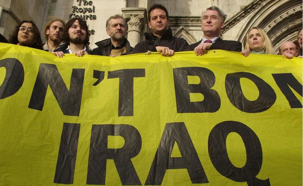 Comedian and CND supporter Mark Thomas (centre) joins Labour MP Jeremy Corbyn (centre-left) and Plaid Cymr"s Hywel Williams (centre-right) and other protesters outside the Royal Courts of Justice in central London.