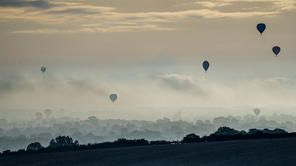 Hot air balloons flying over Castle Howard
