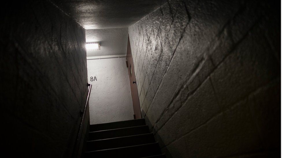 A light illuminates the stairwell where Akai Gurley was fatally shot by rookie NYPD officer Peter Liang at the Louis Pink Houses public housing complex in the Brooklyn borough of New York.