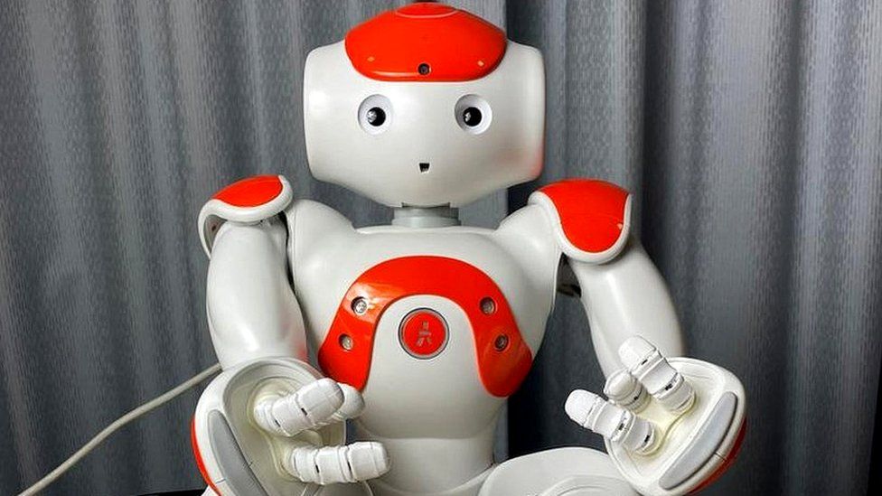 A Nao humanoid robot that is about 60cm tall