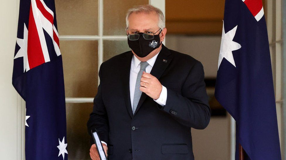 Australian Prime Minister Scott Morrison arrives for a media conference