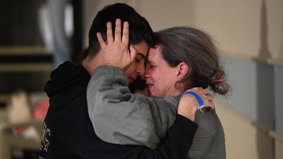 Sharon Avigdori (right) embraces her son Omer after her release from Gaza