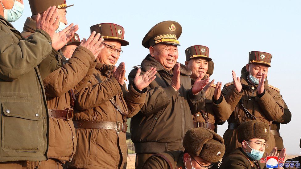 North Korean military staff clapping