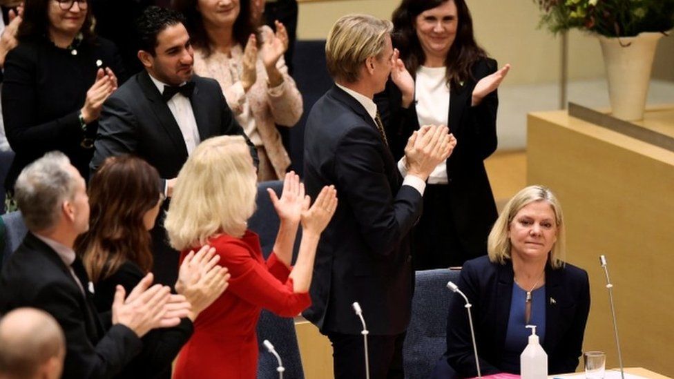 Swedish MPs clap as Magdalena Andersson is voted in as PM
