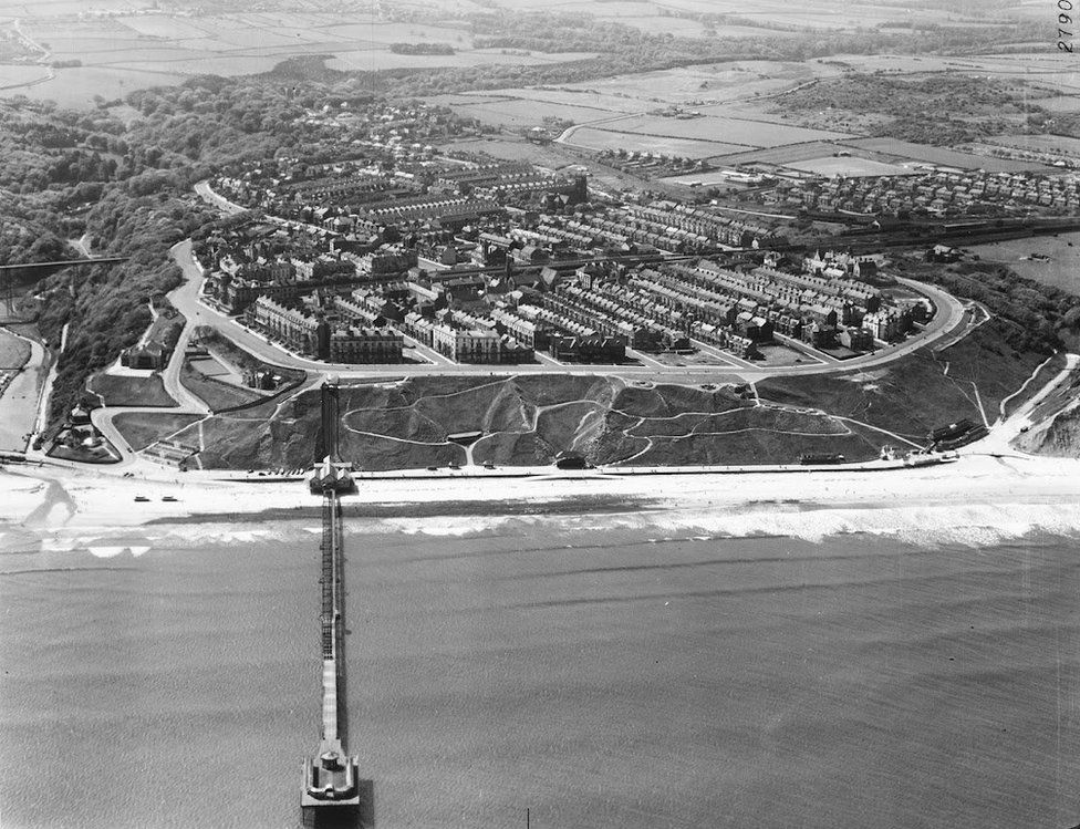 Aerial black and white view of Saltburn pier and town