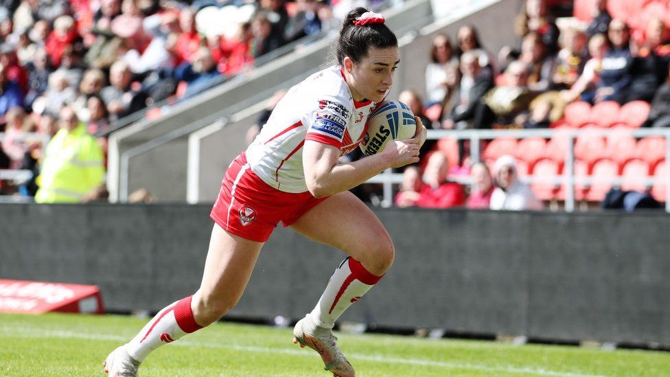 A St Helens Rugby FC player running down this pitch