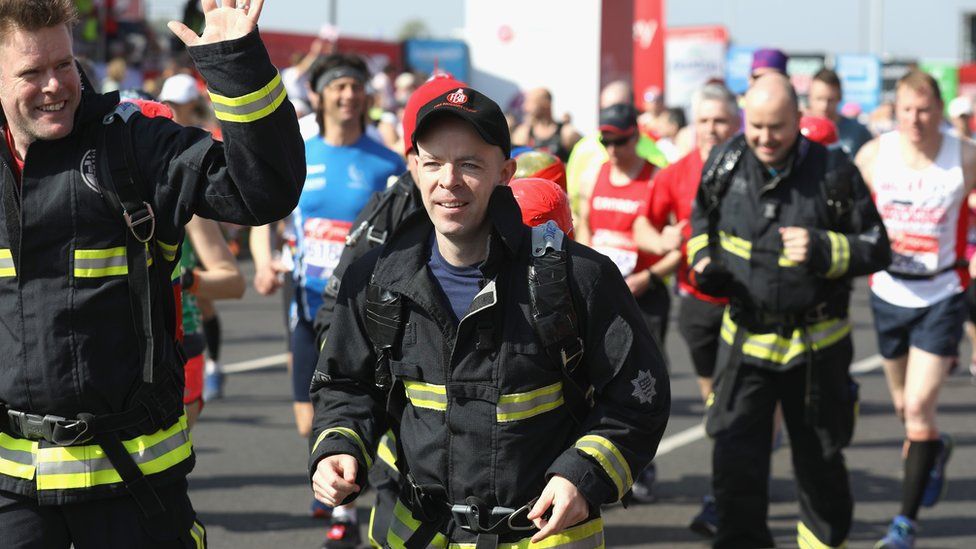 Firefighters running in the marathon