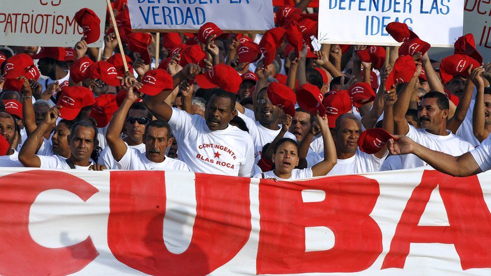 Cuban workers arrive at the Revolution Square in Havana to take part in the May Day parade 01 May 2007