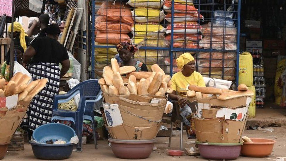 Vendors sell bread in Duekué, western Ivory Coast, 9 October 2020