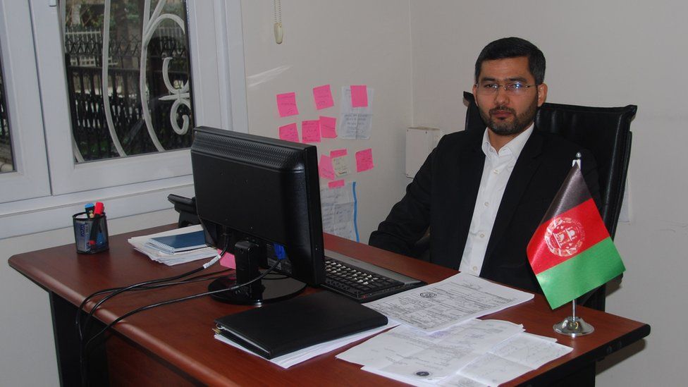 Zia Zaki at his desk in the Afghan consulate in Istanbul