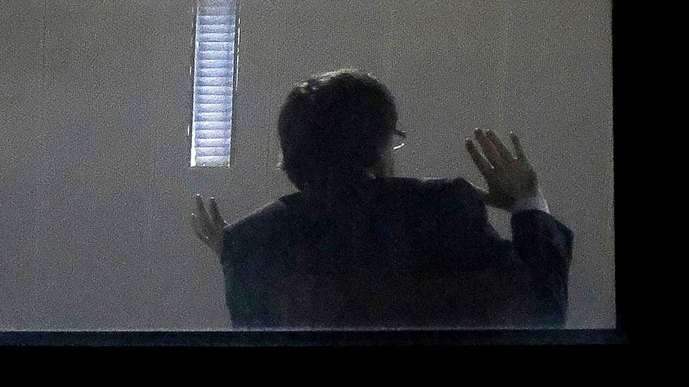 Carles Puigdemont gestures inside the public prosecutor's office in Brussels, on November 5, 2017