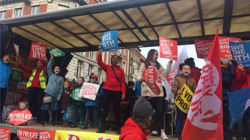 PRO-LIFE CAMPAIGNERS WAVE PLACARDS
